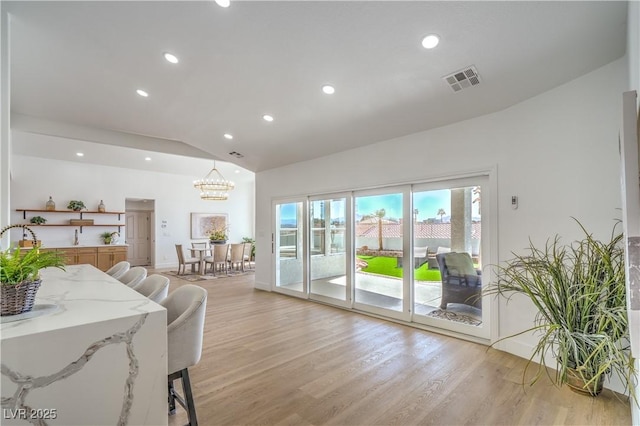 1144 Calico Ridge Dr, Henderson, NV 89011 - living room featuring lofted ceiling, a chandelier, light wood-style floors, and recessed lighting