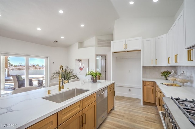 1144 Calico Ridge Dr, Henderson, NV 89011 - kitchen featuring appliances with stainless steel finishes, light stone countertops, recessed lighting, light wood-style flooring, and backsplash