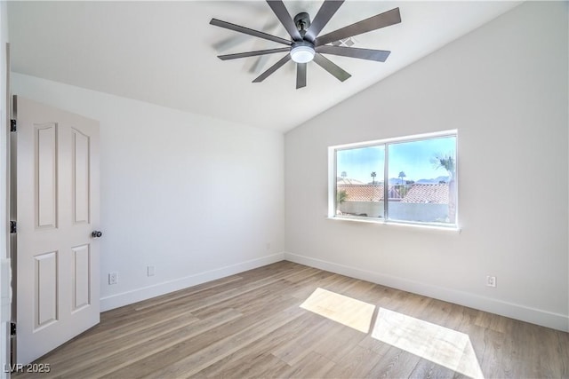 1144 Calico Ridge Dr, Henderson, NV 89011 - spare room featuring lofted ceiling, a ceiling fan, and light wood-style flooring