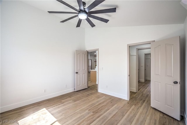 1144 Calico Ridge Dr, Henderson, NV 89011 - unfurnished bedroom with light wood-style floors, high vaulted ceiling, and ceiling fan