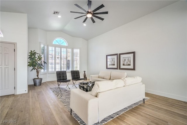 1144 Calico Ridge Dr, Henderson, NV 89011 - living room with a ceiling fan, vaulted ceiling, and light wood finished floors
