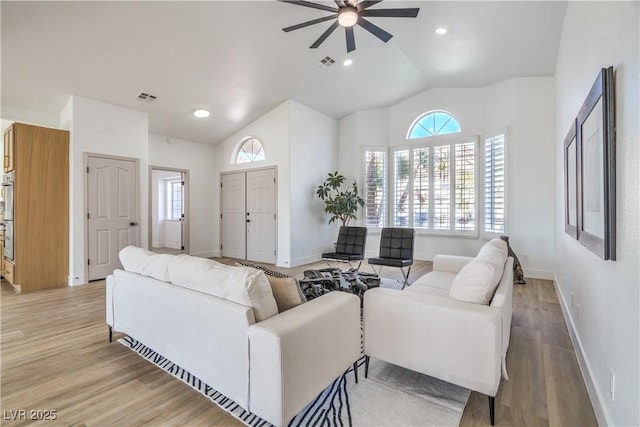 1144 Calico Ridge Dr, Henderson, NV 89011 - living room featuring ceiling fan, healthy amount of natural light, light wood-type flooring, high vaulted ceiling, and recessed lighting