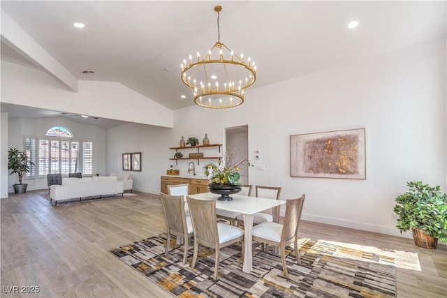 1144 Calico Ridge Dr, Henderson, NV 89011 - dining area with vaulted ceiling, light wood-type flooring, a chandelier, and recessed lighting