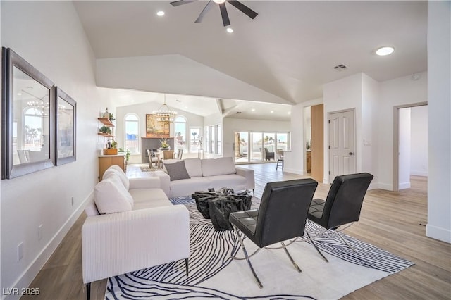 1144 Calico Ridge Dr, Henderson, NV 89011 - living room with lofted ceiling, ceiling fan, light wood-style floors, recessed lighting, and a chandelier