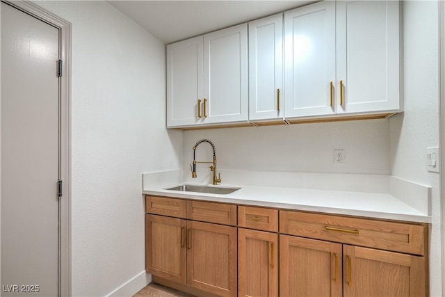 1144 Calico Ridge Dr, Henderson, NV 89011 - kitchen featuring light countertops and white cabinetry