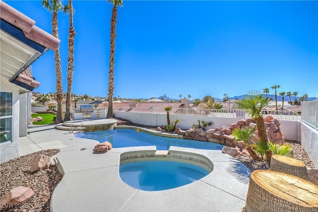 1144 Calico Ridge Dr, Henderson, NV 89011 - view of pool with a fenced backyard, a pool with connected hot tub, and a patio