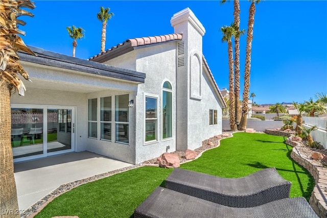1144 Calico Ridge Dr, Henderson, NV 89011 - back of house with stucco siding, a fenced backyard, a patio area, and a tile roof