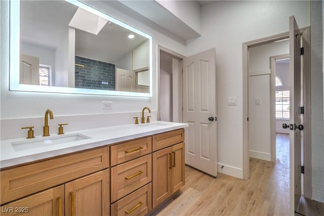 1144 Calico Ridge Dr, Henderson, NV 89011 - bathroom with double vanity and wood finished floors