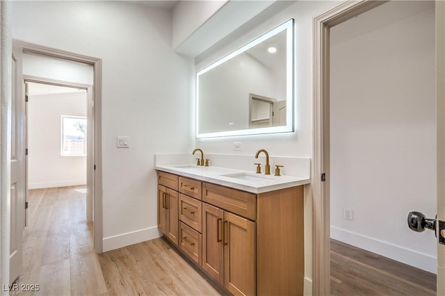 1144 Calico Ridge Dr, Henderson, NV 89011 - bathroom featuring wood finished floors and double vanity