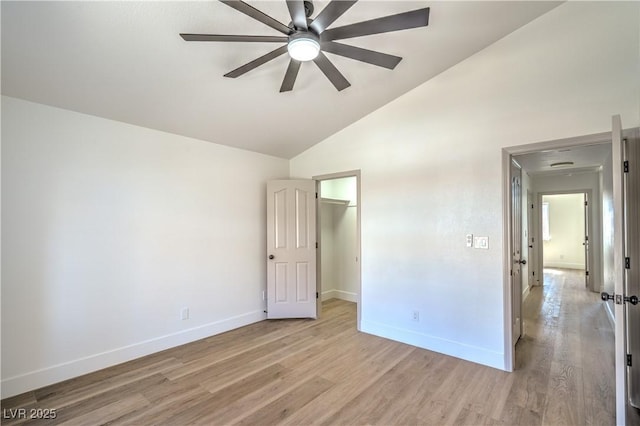 1144 Calico Ridge Dr, Henderson, NV 89011 - unfurnished bedroom featuring light wood-type flooring, high vaulted ceiling, a spacious closet, and ceiling fan