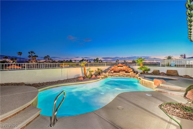 1144 Calico Ridge Dr, Henderson, NV 89011 - pool at dusk featuring a fenced backyard and a pool with connected hot tub
