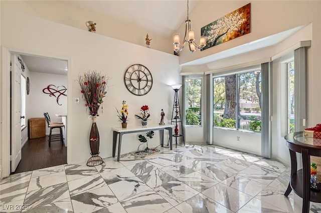 7068 Bright Springs Ct, Las Vegas, NV 89113 - foyer with a chandelier and marble finish flooring