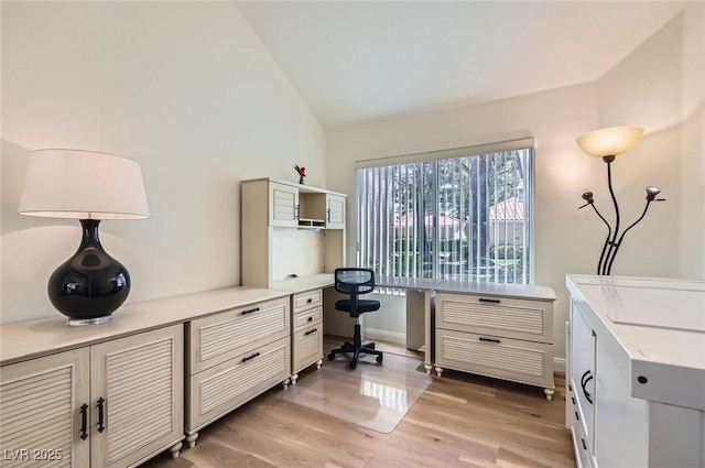 7068 Bright Springs Ct, Las Vegas, NV 89113 - office area with vaulted ceiling, light wood-style floors, and built in desk