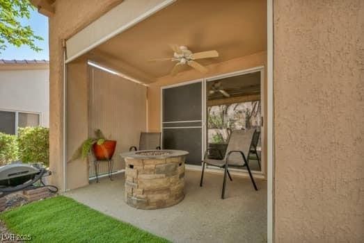 2135 Hallston St, Las Vegas, NV 89134 - view of patio featuring an outdoor fire pit and a ceiling fan