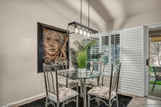 2135 Hallston St, Las Vegas, NV 89134 - tiled dining space featuring lofted ceiling