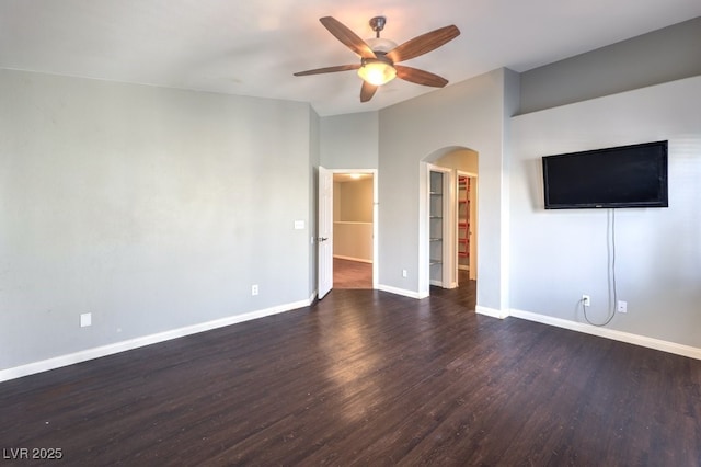 6068 Shyley St Unit 102, Henderson, NV 89011 - unfurnished living room with arched walkways, a ceiling fan, wood finished floors, and vaulted ceiling