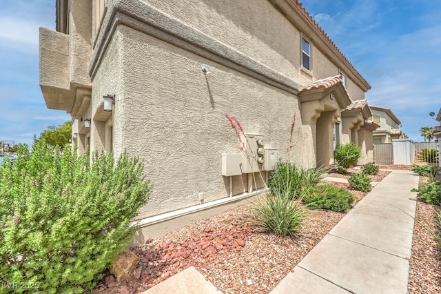 6068 Shyley St Unit 102, Henderson, NV 89011 - view of home's exterior with stucco siding and a tile roof
