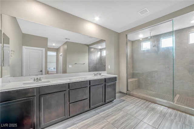 10189 Magnolia Creek St, Las Vegas, NV 89141 - bathroom featuring double vanity and a tile shower