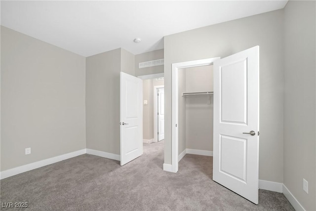 10189 Magnolia Creek St, Las Vegas, NV 89141 - unfurnished bedroom with light carpet, a closet, and a walk in closet