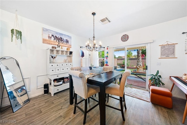 5520 Carrara Pointe St, Pahrump, NV 89061 - dining room featuring a chandelier and wood finished floors
