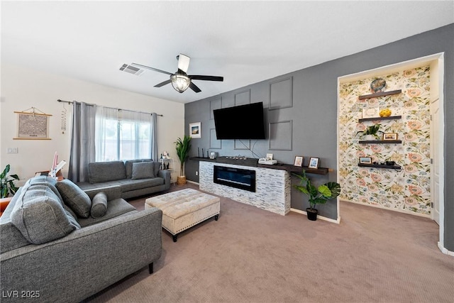 5520 Carrara Pointe St, Pahrump, NV 89061 - carpeted living room with ceiling fan and a glass covered fireplace