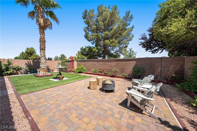 5520 Carrara Pointe St, Pahrump, NV 89061 - fenced backyard with a fire pit and a patio area