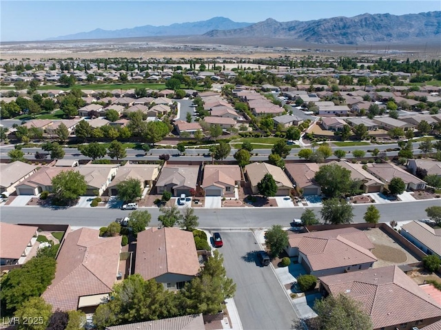 5520 Carrara Pointe St, Pahrump, NV 89061 - aerial perspective of suburban area featuring a mountain backdrop
