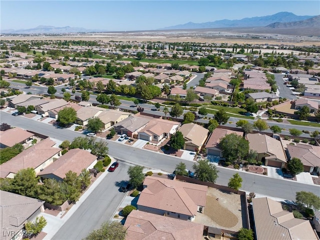 5520 Carrara Pointe St, Pahrump, NV 89061 - aerial perspective of suburban area featuring a mountainous background
