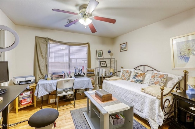 7721 Beach Falls Ct, Las Vegas, NV 89149 - bedroom featuring wood finished floors, a ceiling fan, and an office area
