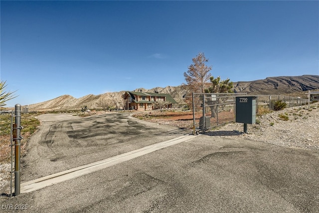 7790 Scottie St, Las Vegas, NV 89166 - view of road featuring a mountain view and a gate