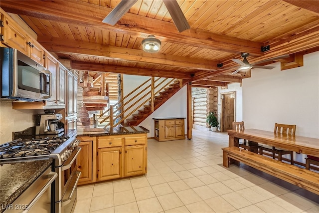 7790 Scottie St, Las Vegas, NV 89166 - kitchen with appliances with stainless steel finishes, a wood ceiling with exposed beams, ceiling fan, light tile patterned floors, and dark stone counters