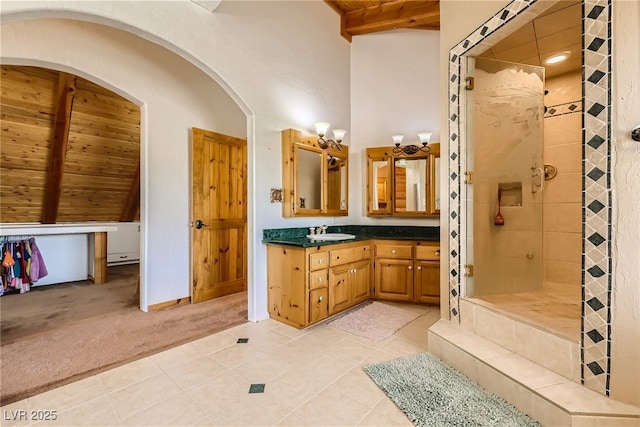 7790 Scottie St, Las Vegas, NV 89166 - full bath with a wooden ceiling with exposed beams, vanity, tiled shower, and tile patterned floors