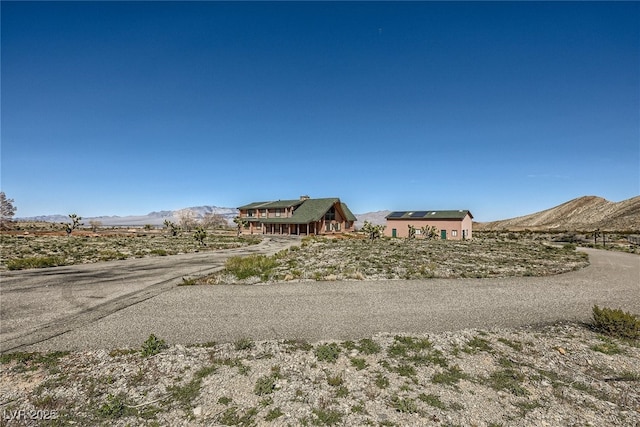 7790 Scottie St, Las Vegas, NV 89166 - view of asphalt road featuring a mountain view