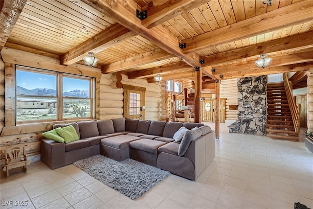 7790 Scottie St, Las Vegas, NV 89166 - living room featuring stairway, a wooden ceiling with exposed beams, rustic walls, light tile patterned floors, and a mountain view