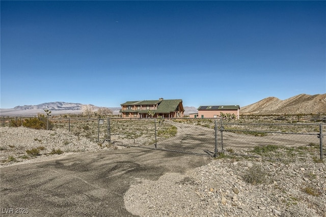 7790 Scottie St, Las Vegas, NV 89166 - view of yard with a mountain view, a gate, and a view of rural / pastoral area