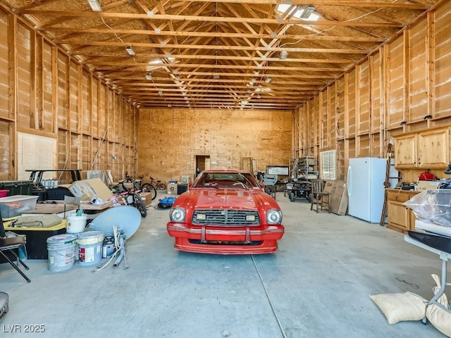 7790 Scottie St, Las Vegas, NV 89166 - garage with freestanding refrigerator