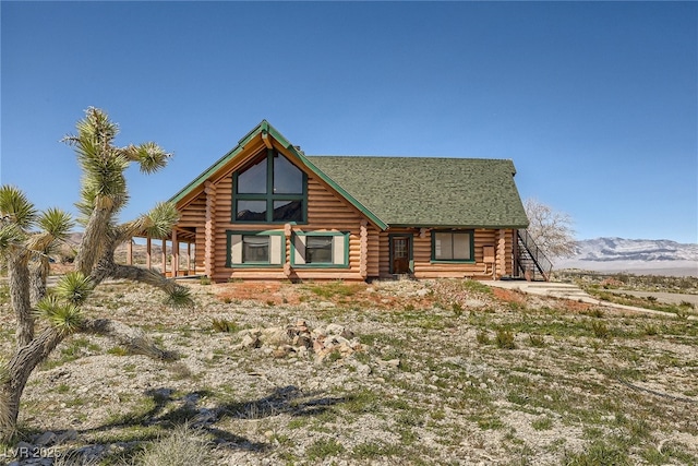 7790 Scottie St, Las Vegas, NV 89166 - view of front facade featuring log siding and a mountain view