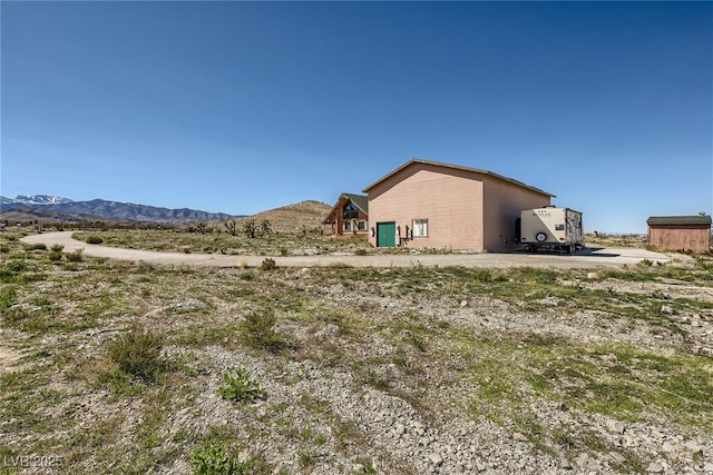 7790 Scottie St, Las Vegas, NV 89166 - view of yard with a mountain view