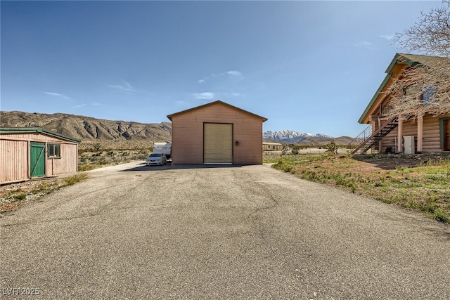 7790 Scottie St, Las Vegas, NV 89166 - view of shed with a mountain view and stairs