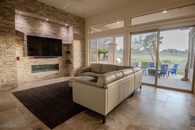 9 Knob Oak Dr, Henderson, NV 89052 - living room featuring a fireplace and a ceiling fan