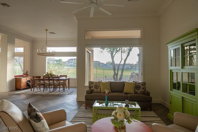 9 Knob Oak Dr, Henderson, NV 89052 - living room featuring a chandelier, ceiling fan, and crown molding