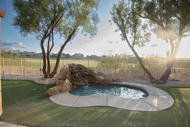 9 Knob Oak Dr, Henderson, NV 89052 - view of swimming pool featuring an area to practice putting and a fenced backyard