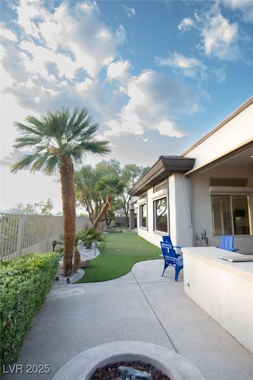 9 Knob Oak Dr, Henderson, NV 89052 - view of patio / terrace with an outdoor fire pit
