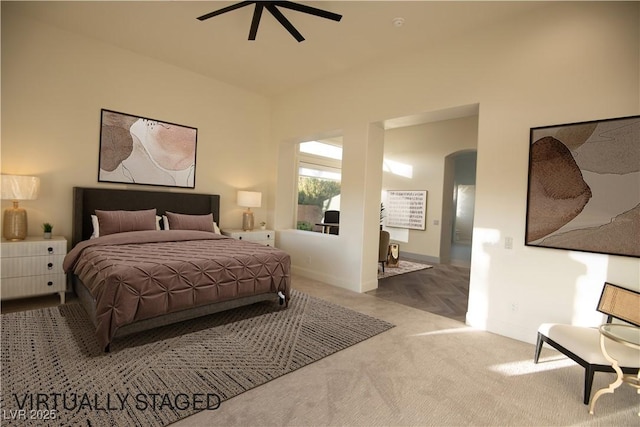 9 Knob Oak Dr, Henderson, NV 89052 - carpeted bedroom featuring arched walkways and a ceiling fan