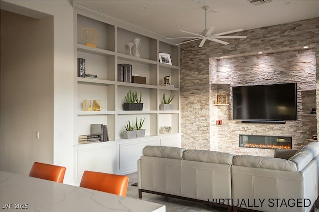 9 Knob Oak Dr, Henderson, NV 89052 - living room with a ceiling fan, built in features, and a fireplace