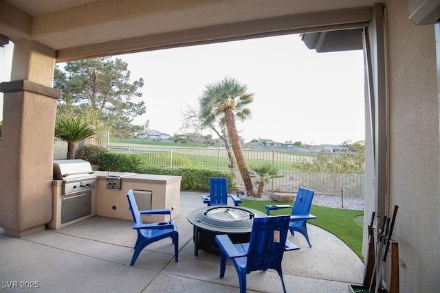 9 Knob Oak Dr, Henderson, NV 89052 - fenced backyard with a patio, area for grilling, and a fire pit