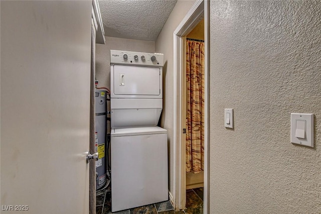 3912 Palos Verdes St, Las Vegas, NV 89119 - laundry area featuring stacked washer and clothes dryer, a textured ceiling, and a textured wall