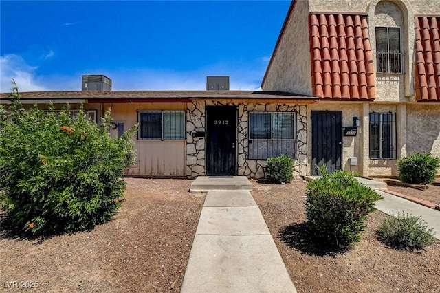3912 Palos Verdes St, Las Vegas, NV 89119 - view of front of property featuring a tile roof and a chimney