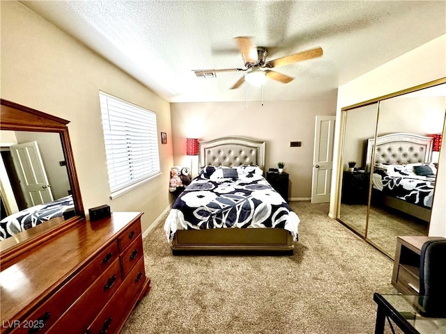 2975 Montessouri St, Las Vegas, NV 89117 - bedroom with carpet, a textured ceiling, a closet, and a ceiling fan