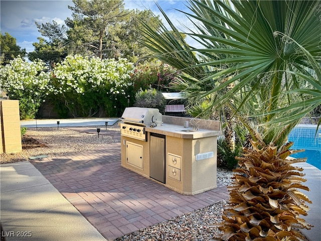 2975 Montessouri St, Las Vegas, NV 89117 - view of patio / terrace with exterior kitchen and a sink